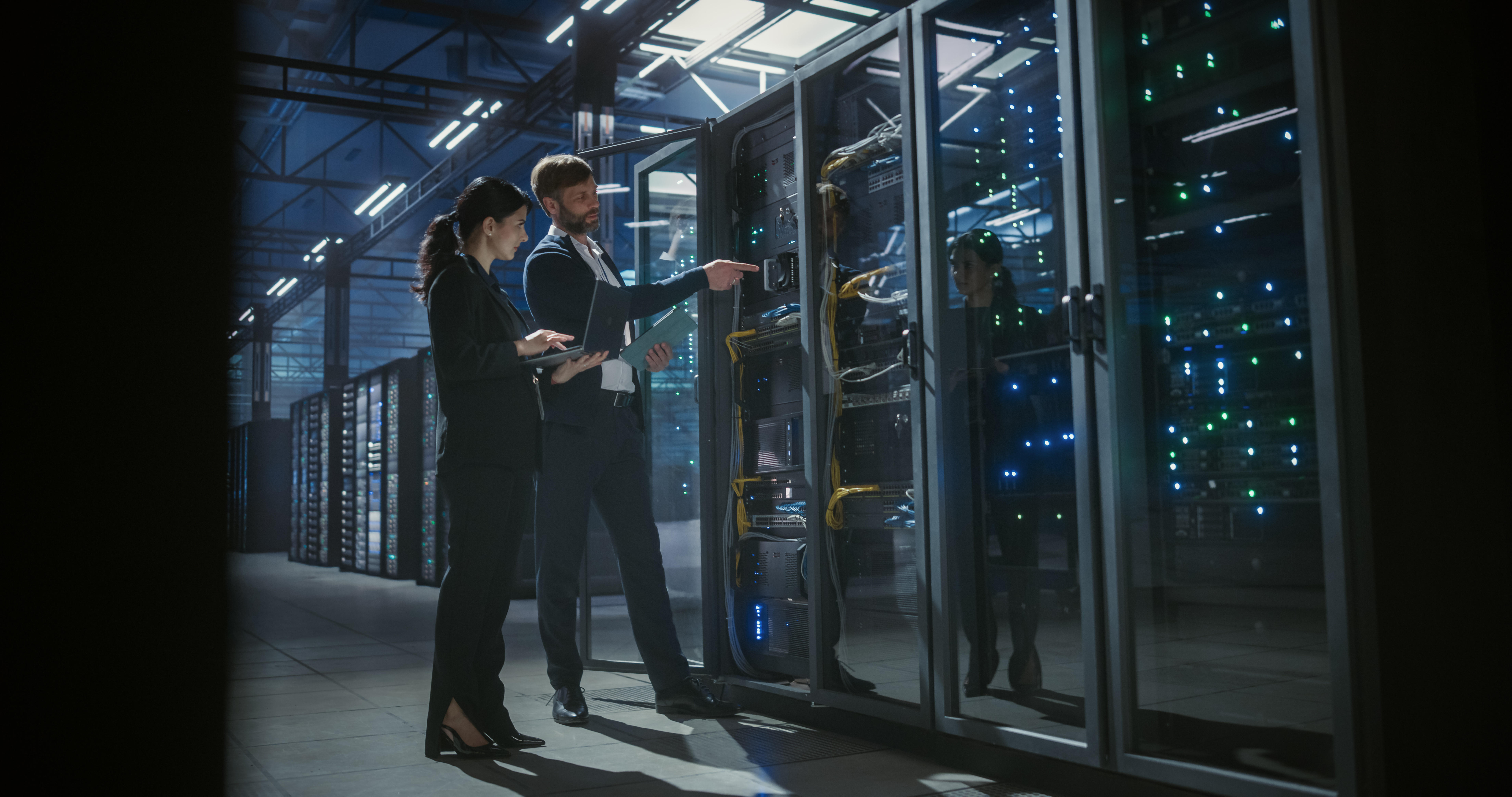 Engineers reviewing infrastructure in a data center